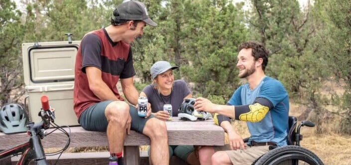 Three friends having fun talking in the park.