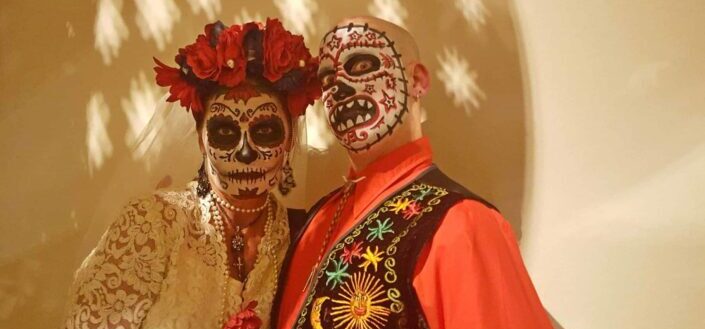 Man and woman all dressed up for a scary costume