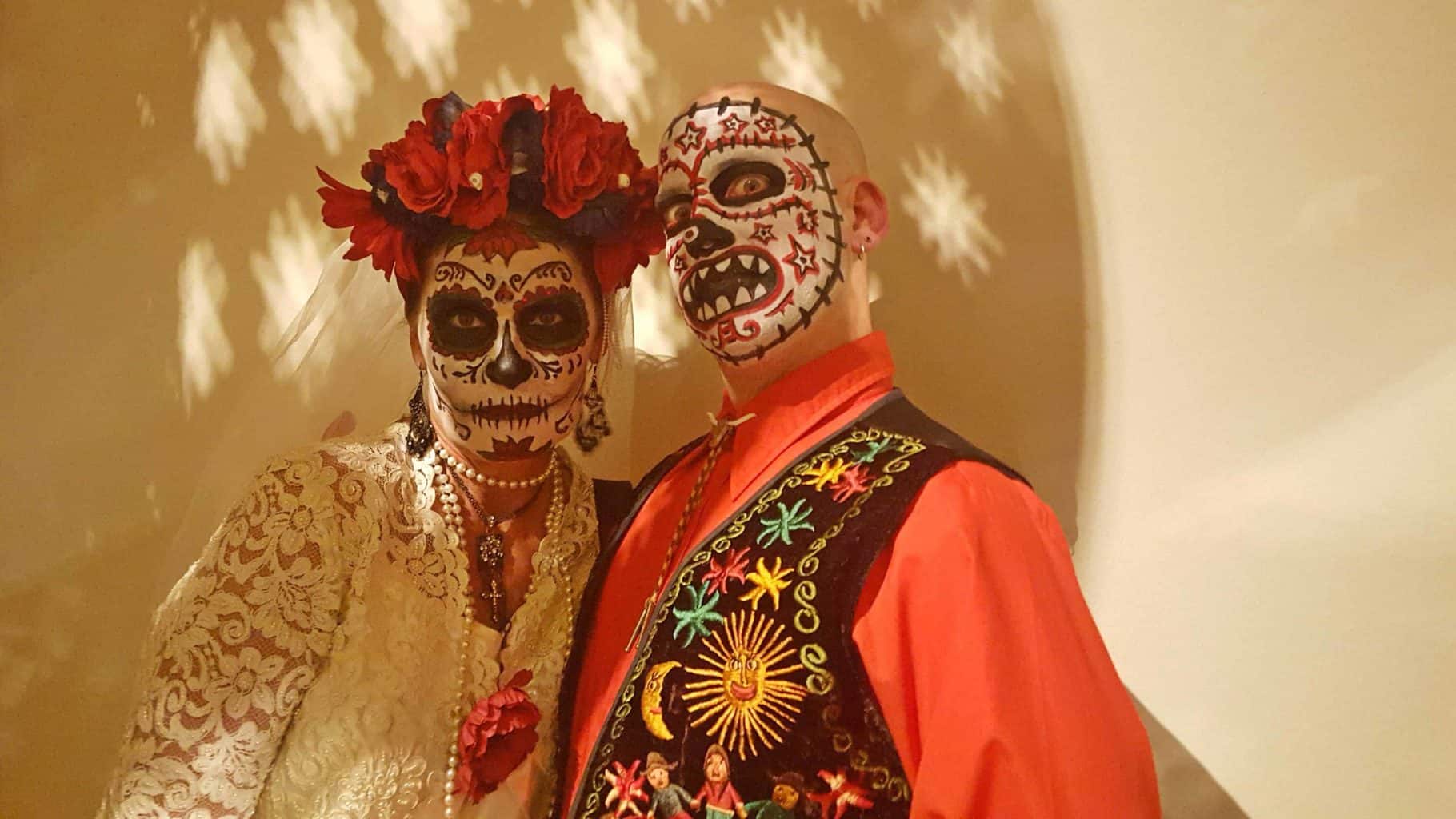 Man and woman all dressed up for a scary costume
