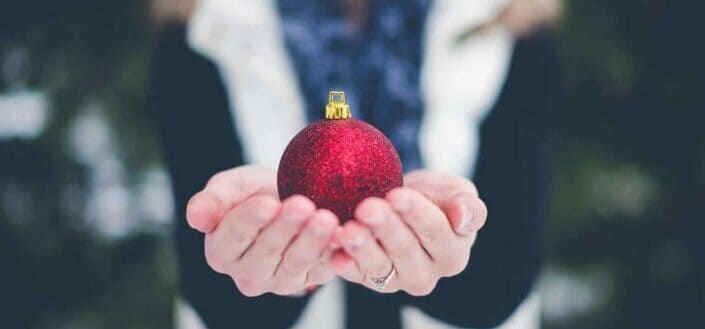 person holding bauble 