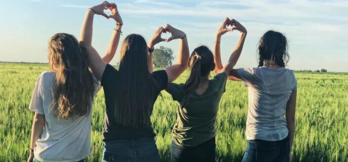 Girl friends making heart-shaped hands