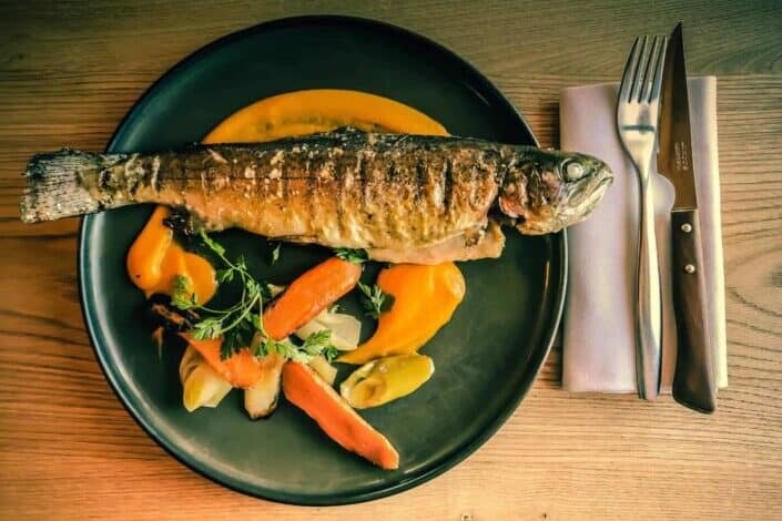 fish dish on blue ceramic plate