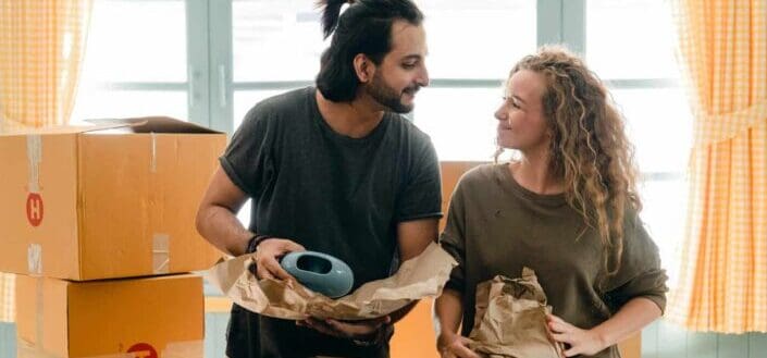 Couple Unpacking Their Stuff to Move in to Their New Place