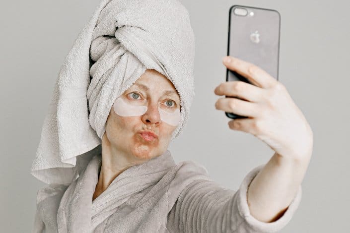 A woman talking selfie after taking a bath