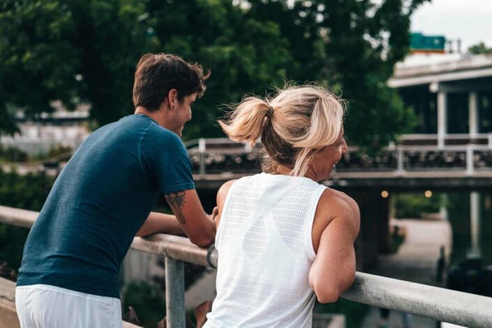 Couple hanging out on a bridge