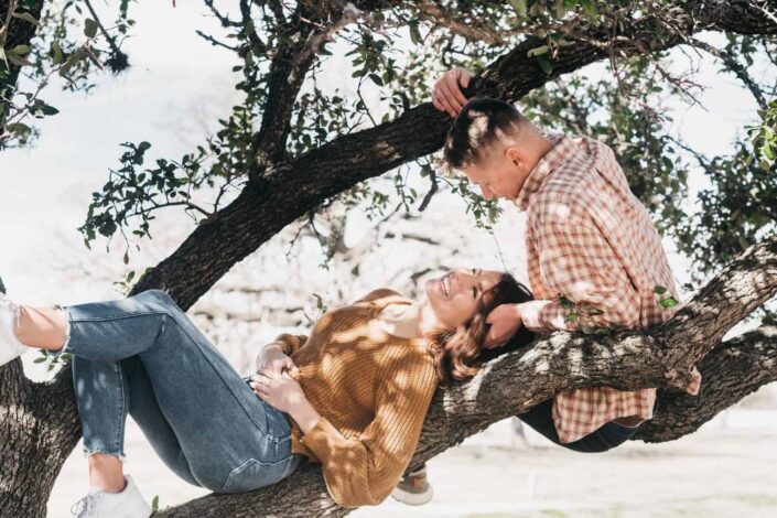 Couple cuddling on the tree