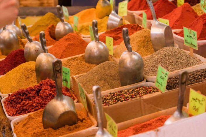 Different spices on individual containers for sale