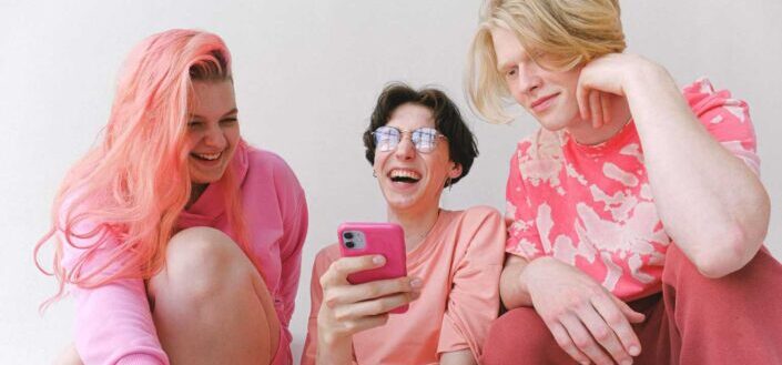 people wearing pink laughing