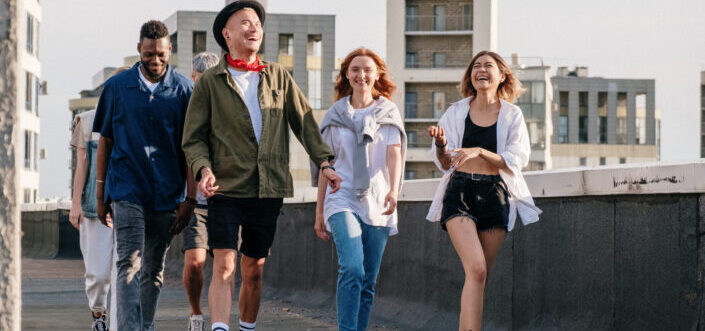 Friends laughing while walking together