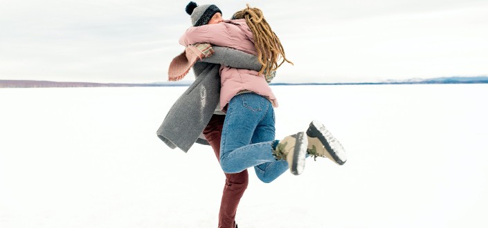 couple hugging in snow