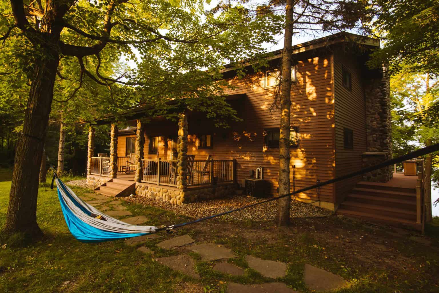 cabin in the woods with a hammock outside