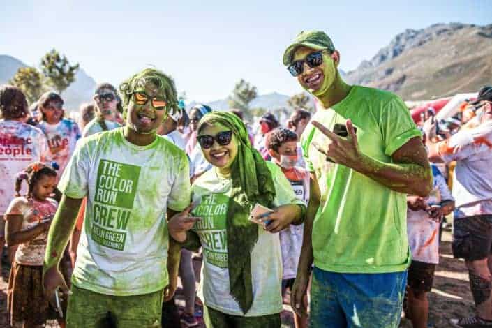 people splashed with powder paint