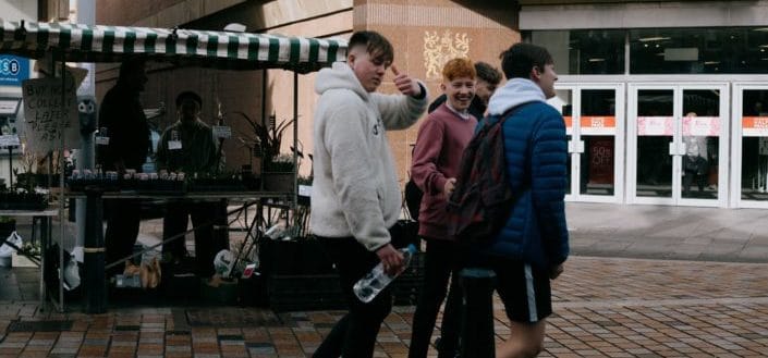 people walking on sidewalks during daytime