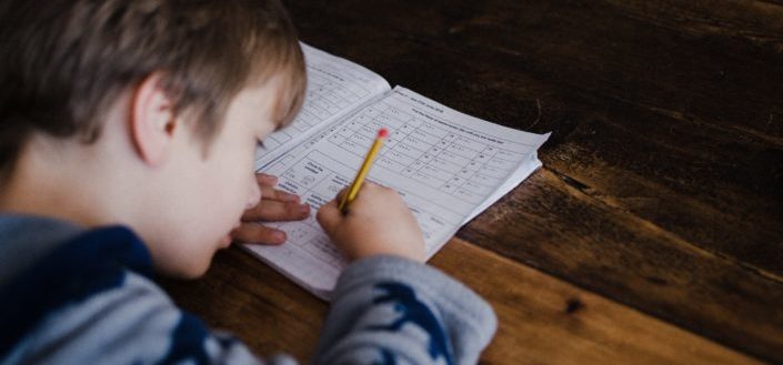 Child completing maths homework
