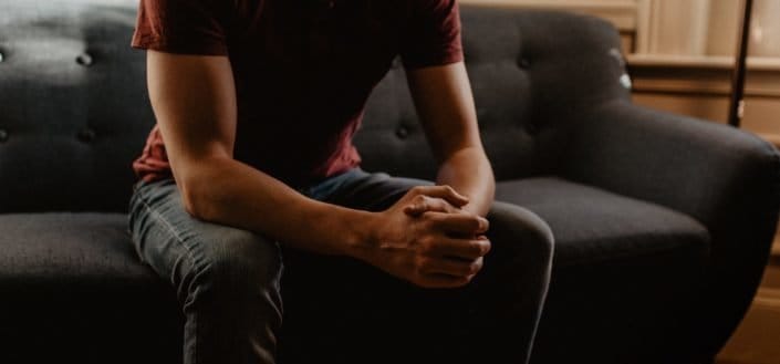 Young man sitting on a couch