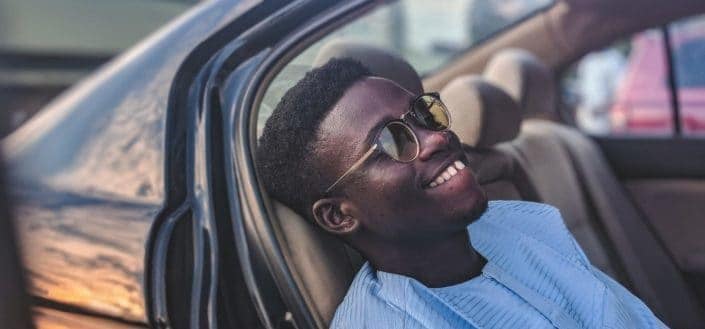 Man riding on a vintage car