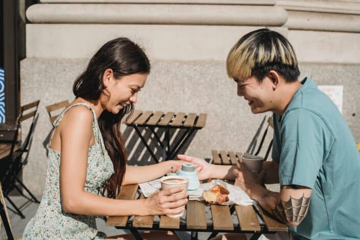 young-cheerful-diverse-couple-holding-hands-and-smiling-pexels