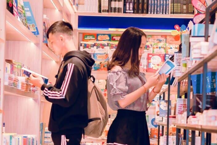 man-and-woman-reading-books-pexels