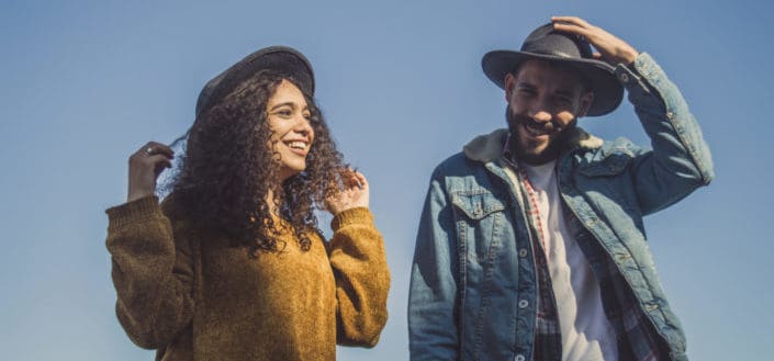 couple having fun talking outdoor while walking.