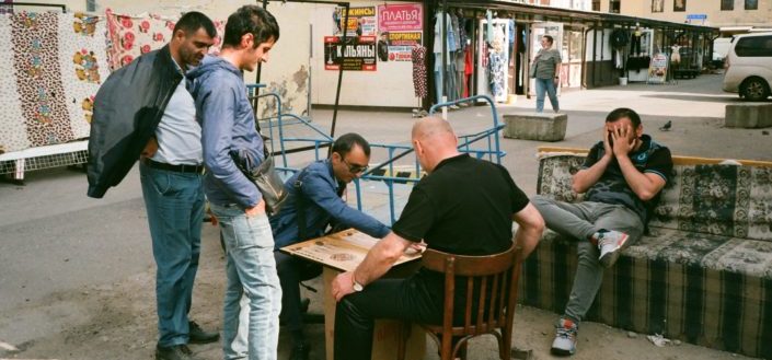 Men playing checkers on the street