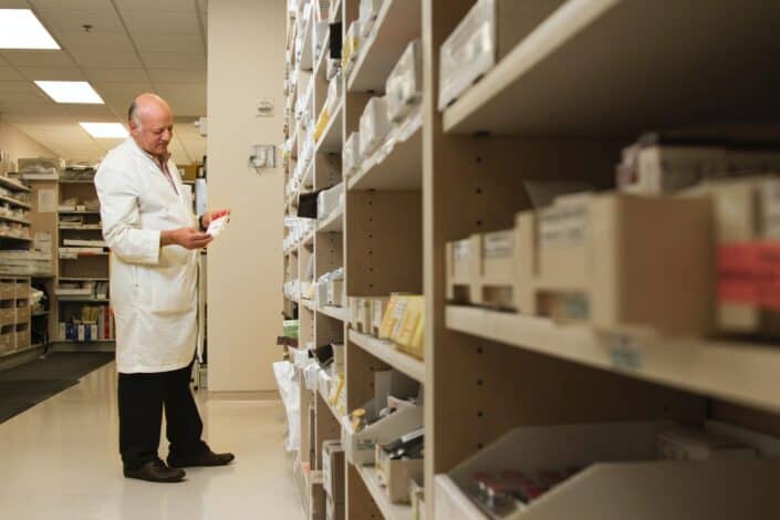 pharmacist examining a drug