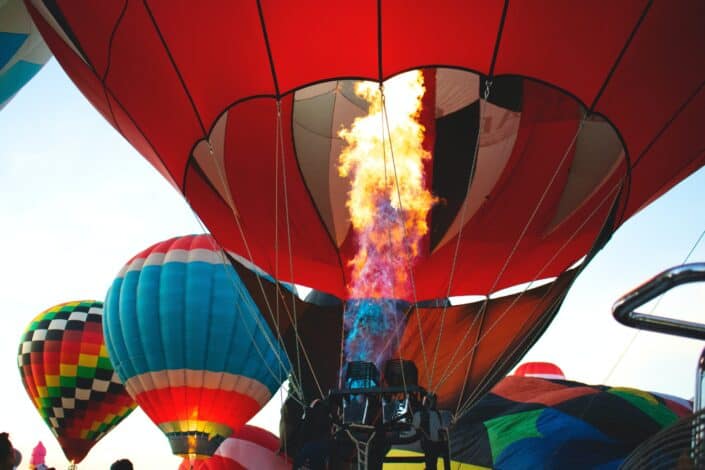 red hot air balloon being fired up