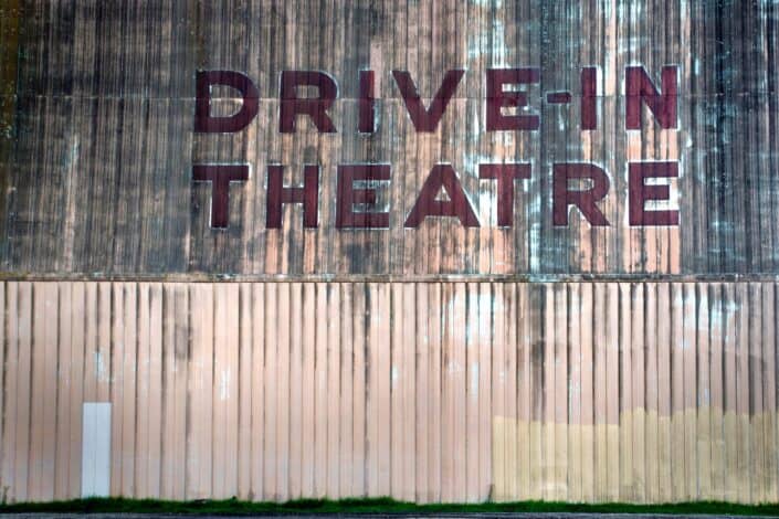 old painted sign of a drive-in theatre