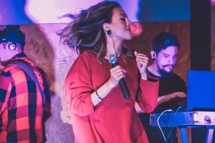 girl holding microphone on stage