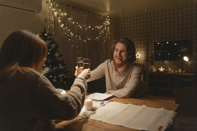 Indoor date Ideas - Couple cheering on a December night
