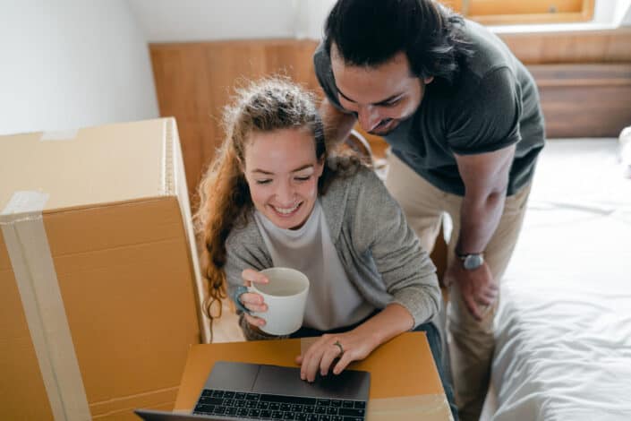 couple surfing internet while drinking coffee