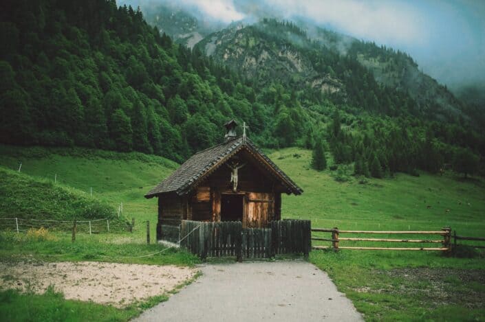 a cabin in the middle of a field