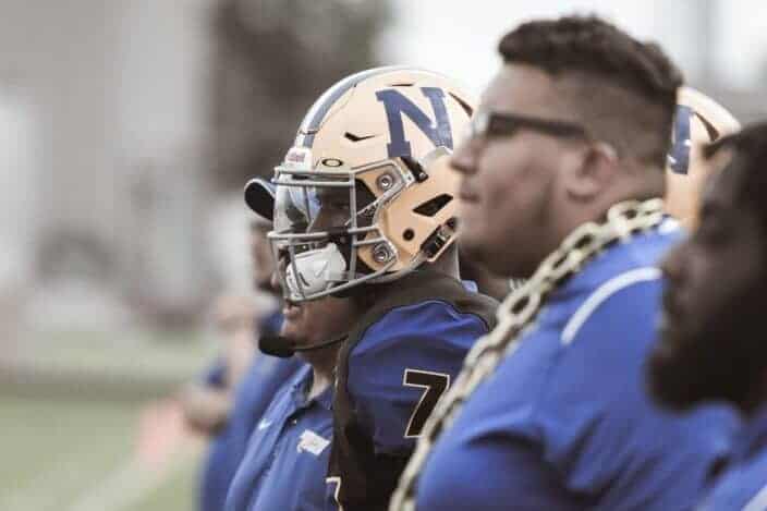 football player with his coach