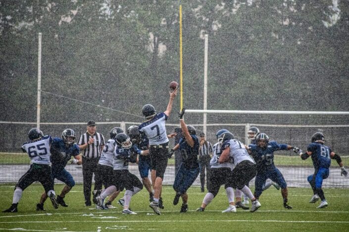 an official football game under the pouring rain 