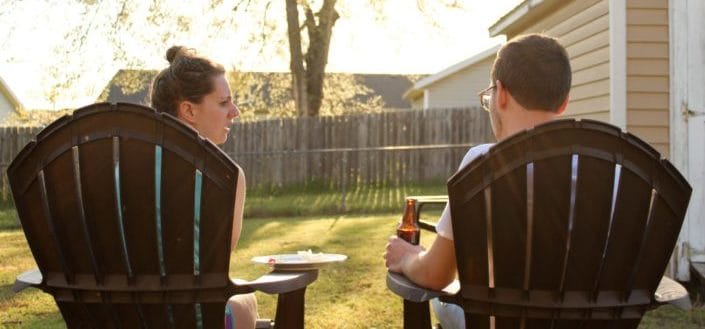 couple having deep talking while sitting outdoor 