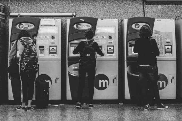 three people withdrawing their money