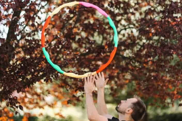 man playing with his hula hoop