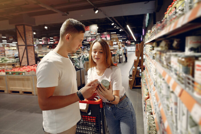 man and woman in a supermarket aisle