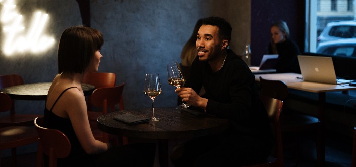 couple drinking champagne while talking