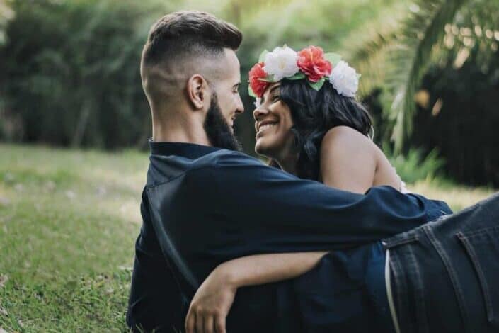 Couple dating in a lush garden.