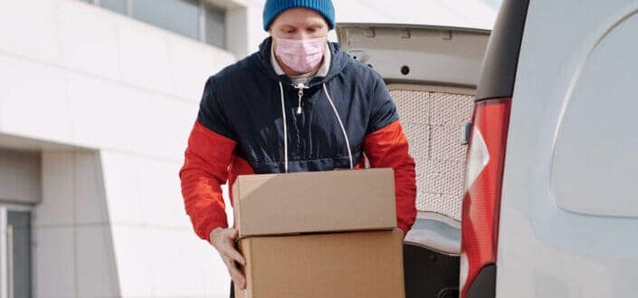 a courier employee carrying boxes