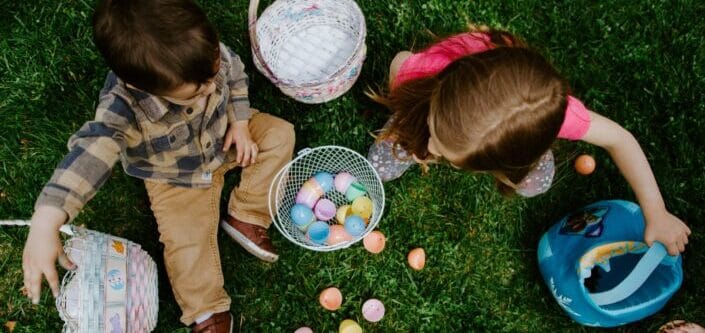 Two kids playing with easter eggs