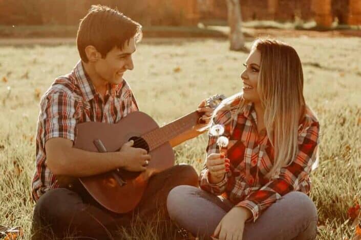 Couple having fun, acoustic moment together.