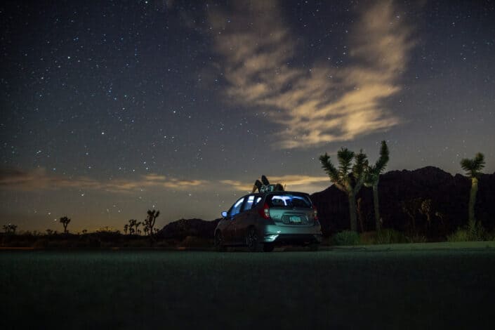 SUV under blue starry sky during nighttime