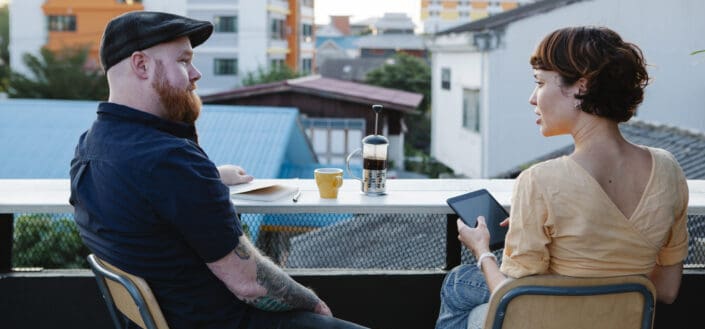 Couple having coffee in the balcony 