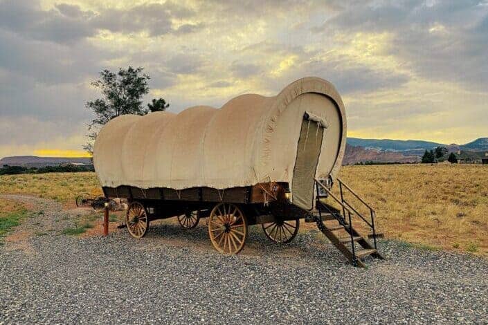 Old trailer parked on a rocky road