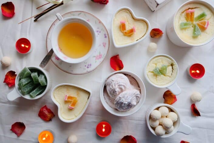 Food inside heart-shaped plates and cups