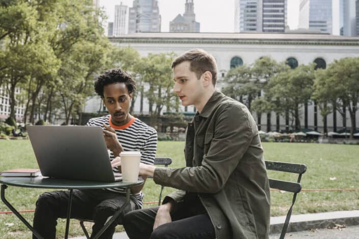 Two men looking seriously at a laptop