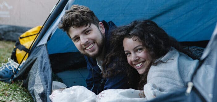 Happy couple inside tent