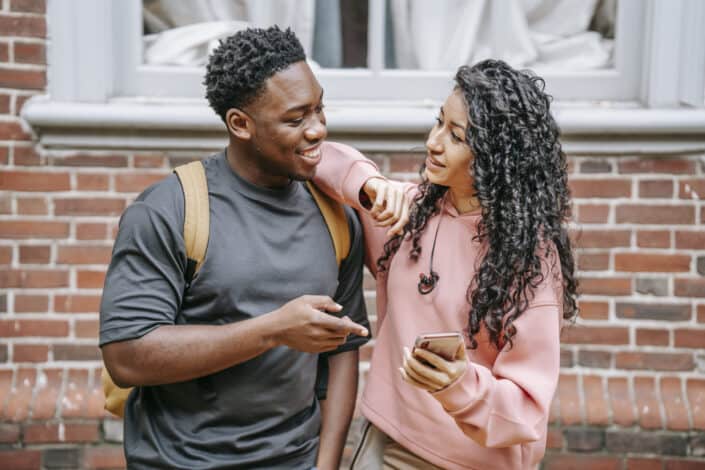 Couple discussing something on phone