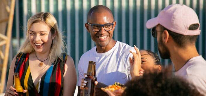 Diverse friends with beer bottles